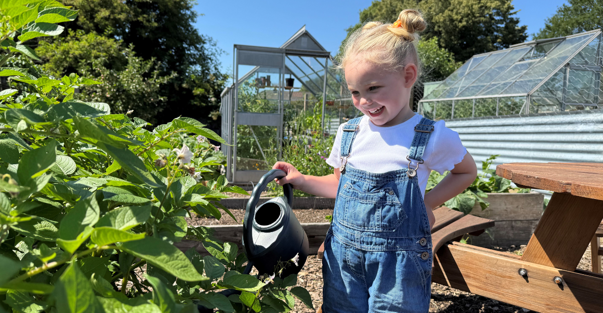 Young child watering